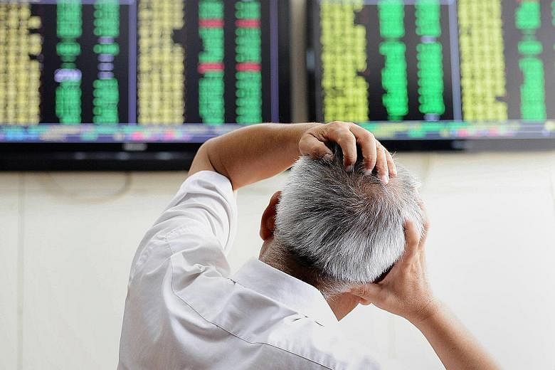 An investor in Qingdao (above) monitoring share-price movements. China was key to the turmoil in Asian stock markets last month. Events in the region such as the Bangkok blast and the Bersih movement in Malaysia are making Asia unattractive to global inve