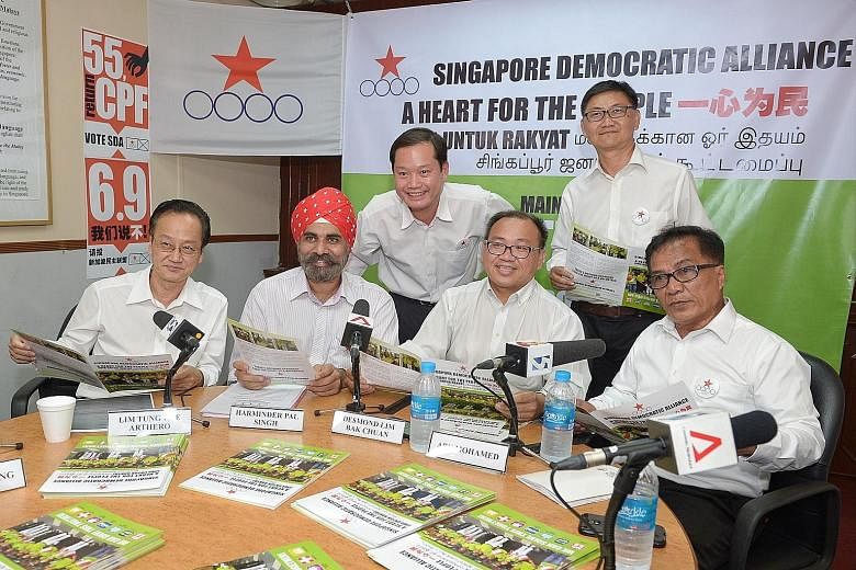 The SDA's Pasir Ris-Punggol GRC team members (from left) Arthero Lim Tung Hee, Harminder Pal Singh, Ong Teik Seng, Desmond Lim Bak Chuan, Wong Way Weng and Abu Mohamed at the press conference yesterday. This is the third time the party is contesting 