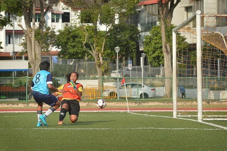 Bowen's Nikki Nur Jannah slotting her shot beyond Greenview goalkeeper Sartikah Ardilaa in the 5-1 rout.