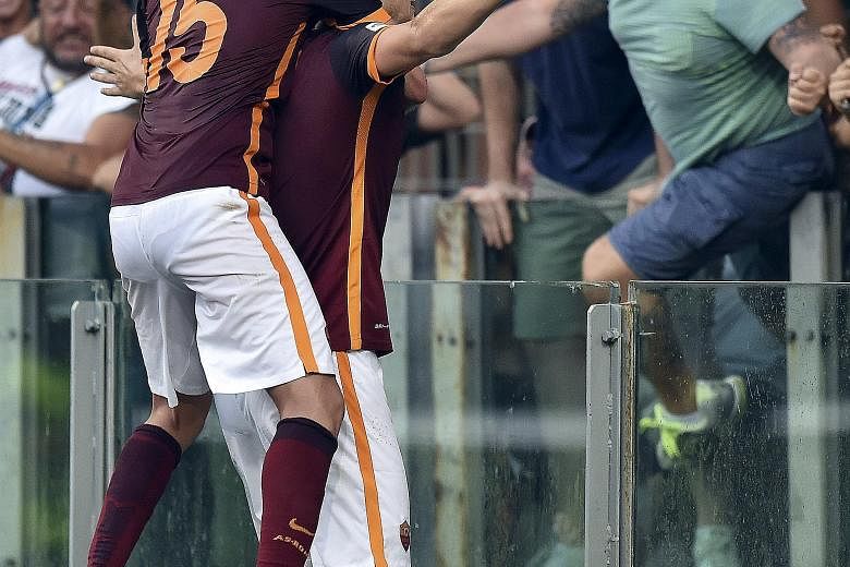 Roma striker Edin Dzeko (right) and team-mate Miralem Pjanic were on target to send a woeful Juventus to two defeats in as many games of the new Serie A season.