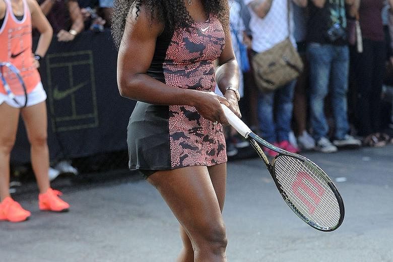 Serena Williams at a New York City street tennis event on Aug 24. She is on the verge of becoming only the fourth woman to complete a calendar-year Grand Slam.