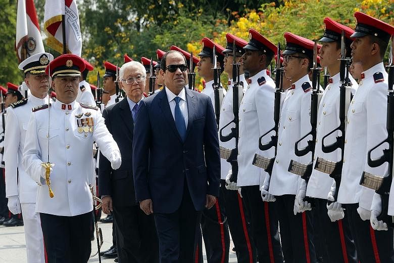 Egyptian President Abdel Fattah al-Sisi, with Singapore President Tony Tan Keng Yam, inspecting the guard of honour during a welcome ceremony at the Istana yesterday. Mr Sisi is on his first state visit here.