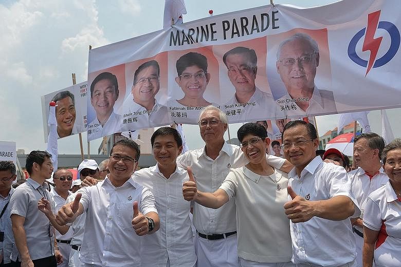 Workers' Party candidates (from left) Firuz Khan, Dylan Ng, He Ting Ru, Yee Jenn Jong and Terence Tan have been spotted pounding the pavement and distributing fliers in the last two months. PAP candidates for Marine Parade GRC (from left) Edwin Tong,