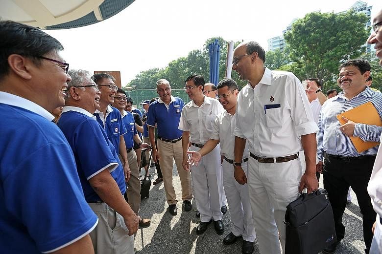 SingFirst candidates for Jurong GRC (from left) Mr Wong Soon Hong, Mr Tan Peng Ann, Mr Wong Chee Wai, Mr David Foo and Mr Sukdeu Singh meeting three members of the PAP team at the nomination centre yesterday. They are (in white, from right) Deputy Pr