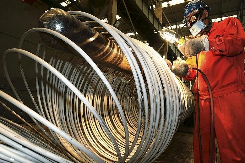 A worker at the Dongbei Special Steel factory in Dalian, Liaoning province. China's official manufacturing Purchasing Managers' Index (PMI) fell to 49.7 last month, from 50.0 in July, according to the National Bureau of Statistics. That was the lowes