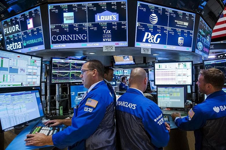 Traders at the New York Stock Exchange. The turbulence on Wall Street last month was the storm that finally came after years of calm for investors.