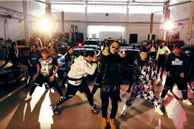 The six-minute music video Lingo Lingo features Ah Boys To Men stars rapping and dancing in front of 50 supercars.