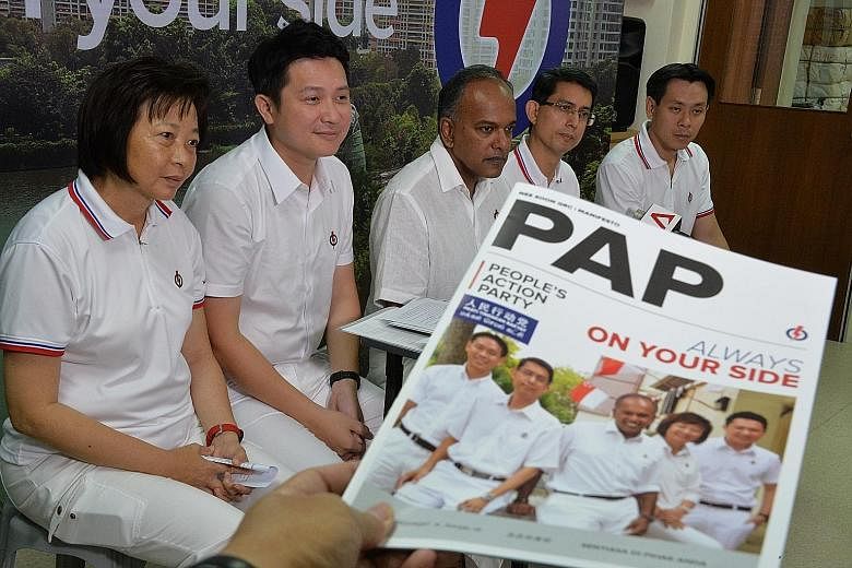 PAP's Nee Soon GRC candidates (from left) Lee Bee Wah, Henry Kwek, K. Shanmugam, Muhammad Faishal Ibrahim and Louis Ng at a press conference to unveil their local manifesto.