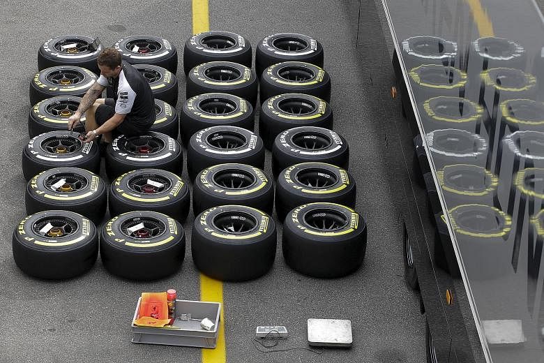 A Mercedes mechanic checks Pirelli tyres before this weekend's Italian Grand Prix. Pirelli, which supplies tyres to all Formula One teams, has said that Sebastian Vettel's blowout denying him a podium place in Belgium was caused by track debris and F
