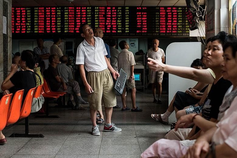 Investors at a Shanghai brokerage. The Chinese authorities are trying to shore up share prices after the benchmark Shanghai index plunged 30 per cent in the three weeks from mid-June.