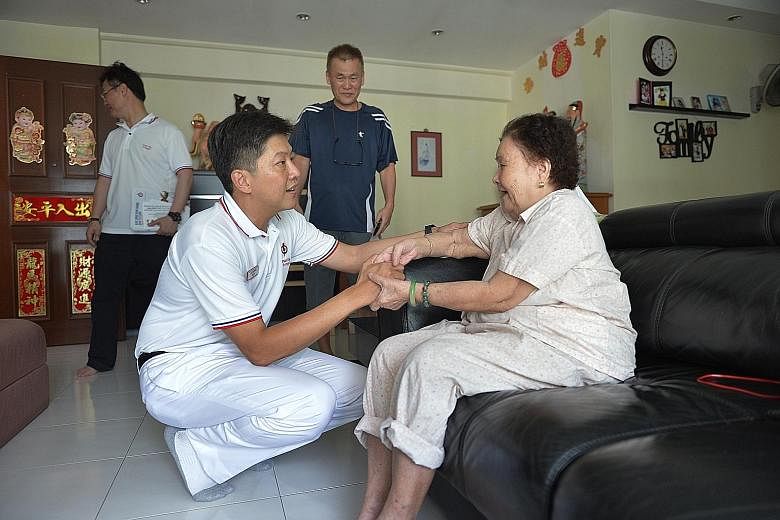 Mr Ng Chee Meng, who is running in Pasir Ris-Punggol GRC, visiting Madam Heng Guat Mei, 85, and her son, Mr Hoo Cheow Aik (in blue), 61, at their home in Punggol on Thursday.