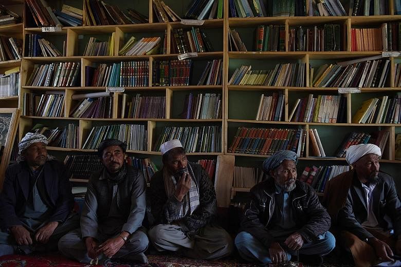 Afghan farmers in Bamiyan province meeting to consider forming a militia to guard the country's largest iron ore reserve buried in the ridges flanking their village.