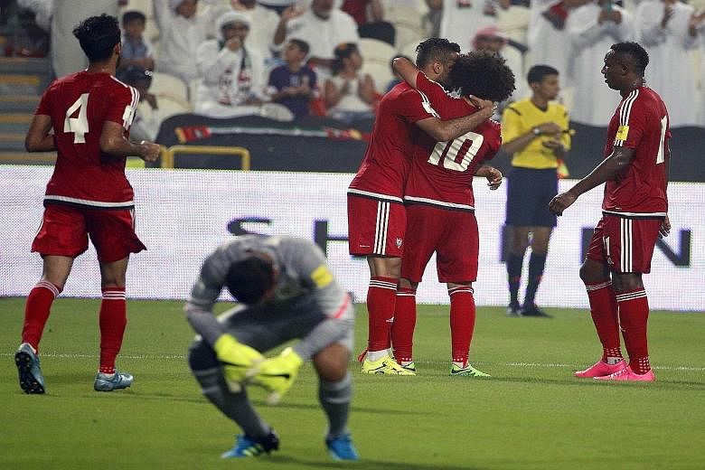 UAE players celebrate after scoring a goal against Malaysia during the 10-0 rout in the AFC qualifying match for the 2018 World Cup in Abu Dhabi on Thursday. The loss prompted Johor crown prince Tunku Ismail Sultan Ibrahim to say the state would cont