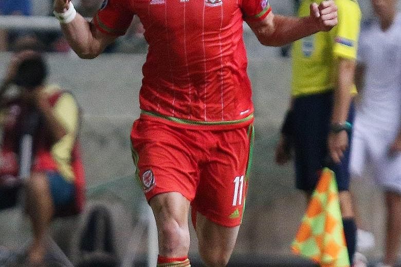 Wales football star Gareth Bale celebrating his winner against Cyprus, which sees his country just one win away from securing their place in next year's European Championships.