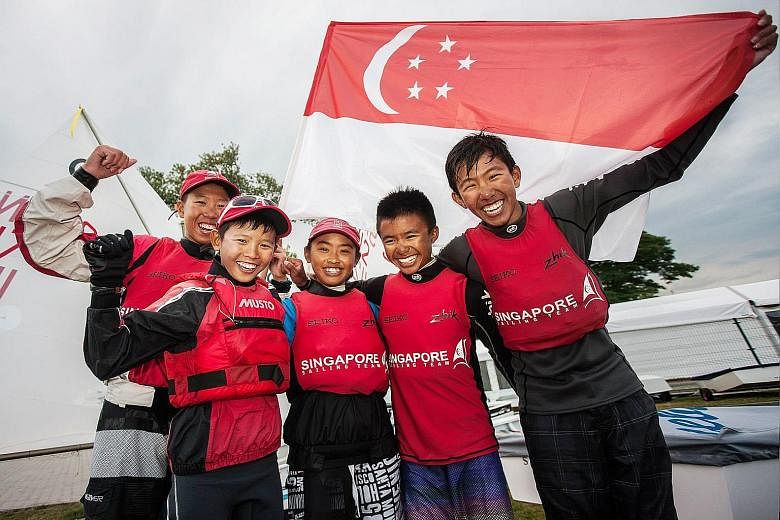 From left: Sailors Koh Yi Nian, Daniel Hung, Jodie Lai, Muhammad Daniel Kei Yazid and James Koh who helped Singapore regain the Optimist world team title in Poland yesterday. Jodie claimed the girls' title too by a huge margin.