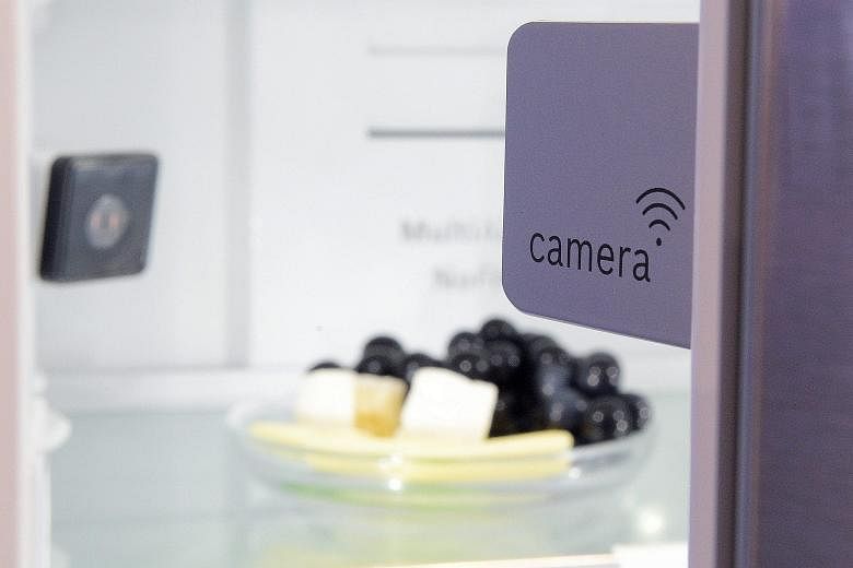 The Smart Things line includes fridge cameras (far left) and the Sleep Sense app.