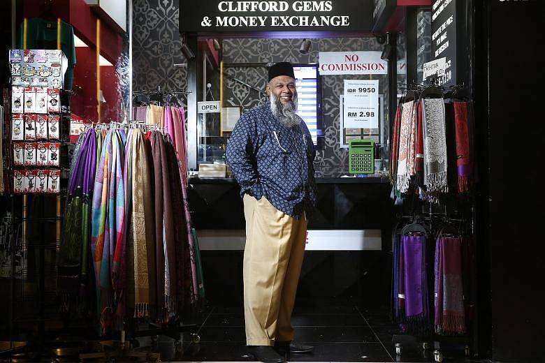 Recent currency fluctuations have made business more difficult. Usually, Mr Rafeeq has one price for the ringgit daily, but now he could have up to three ringgit prices in a day.