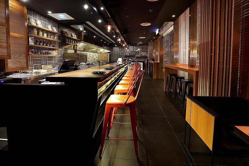 Burger bar Fat Boy's (above) has opened five outlets in Kuala Lumpur since 2012. However, Massive Collective, which operates restaurant Ohla (left) in KL, decided to close nightclub Vertigo - its first venture in KL - last year after a three-year run