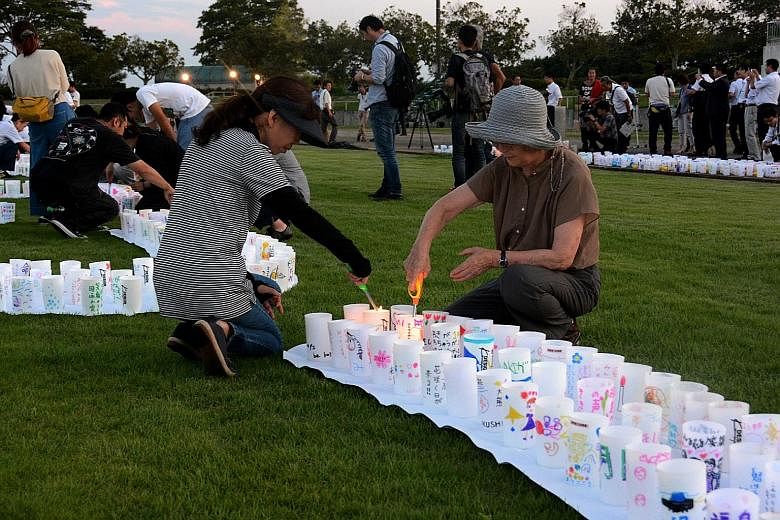 Residents holding a candlelight vigil in Naraha on Friday to mark the rebirth of their town, which was evacuated after the nuclear crisis more than four years ago. The authorities say that the town, one of several affected by the March 2011 disaster,