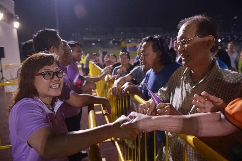 People’s Power Party candidate for Chua Chu Kang GRC, Ms Low Wai Choo, greeting supporters at Bukit Gombak Stadium. 