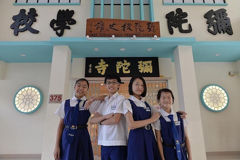 To help visitors fully enjoy the new gallery (above), the school has appointed 10 "heritage centre ambassadors" - including (from left) pupils Shiow Yu Xuan, Kiefer Ong, Chen Bailin and Brina Goh, all aged 11 - to take them on guided tours through its col