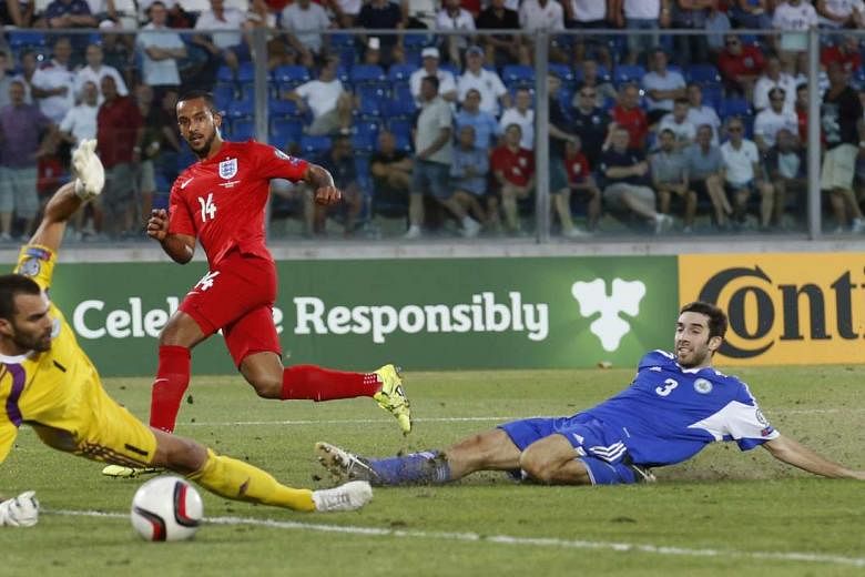 Theo Walcott scoring in England's 6-0 victory against San Marino in the Euro 2016 qualifier on Saturday. Wayne Rooney said the lack of a Euro title, World Cup and FA Cup are a "gap on my CV". 