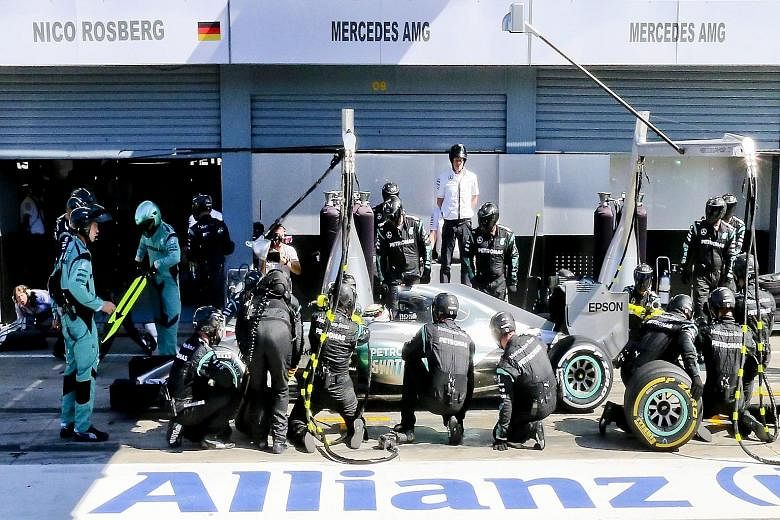 Lewis Hamilton, making a pit stop at Monza, won but the result was kept provisional until stewards decided an under-inflated tyre was permissible.