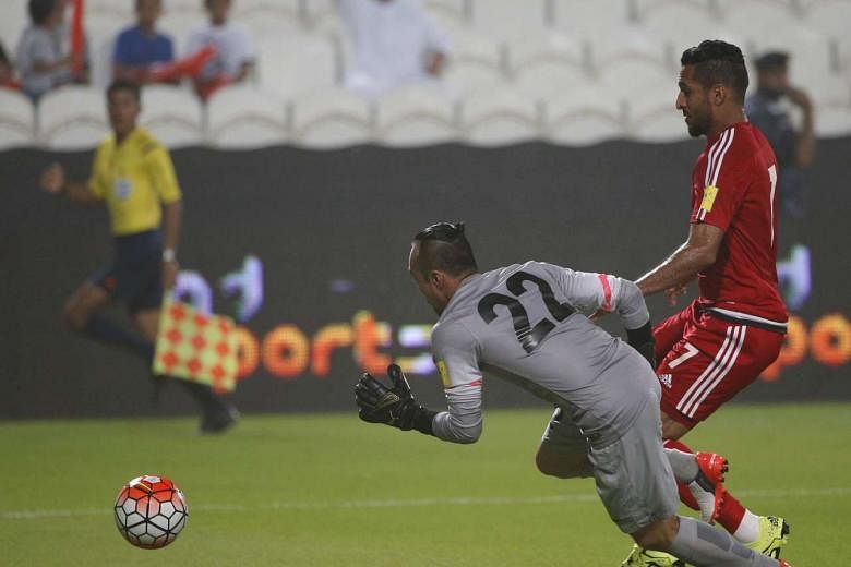 Malaysia goalkeeper Khairul Fahmi (No. 22) conceding one of four UAE goals in the first half. They face Saudi Arabia tonight. 
