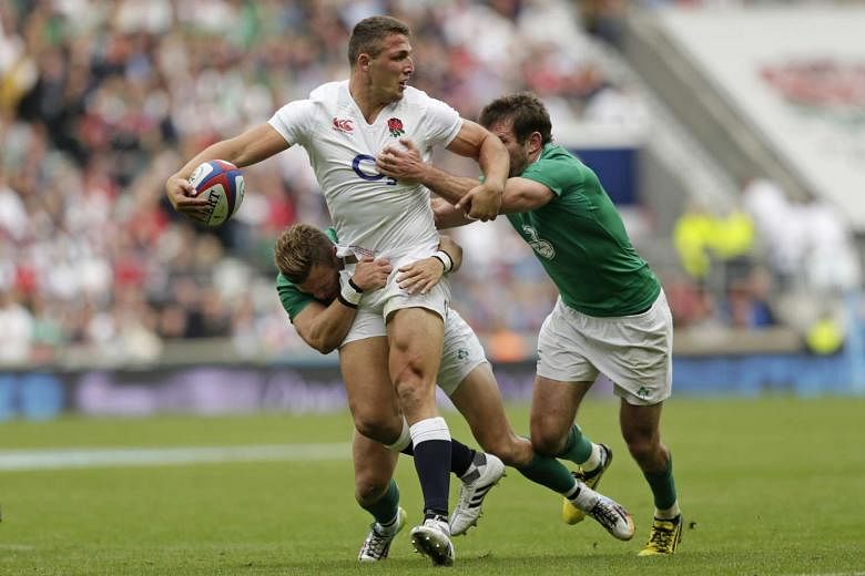 England, with Sam Burgess (in white) in action against Ireland, extended their streak of home wins to seven with a 21-13 triumph. 