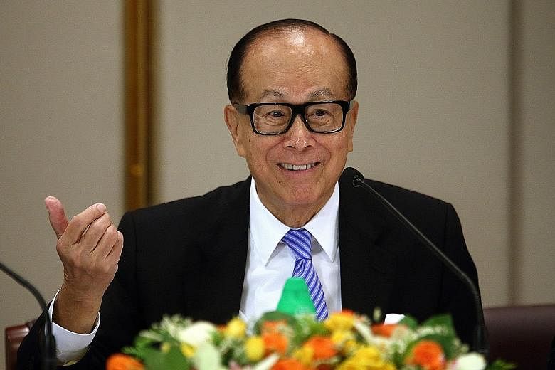 Mr Li Ka Shing is reshuffling his business empire for the second time this year as he seeks fresh acquisitions.