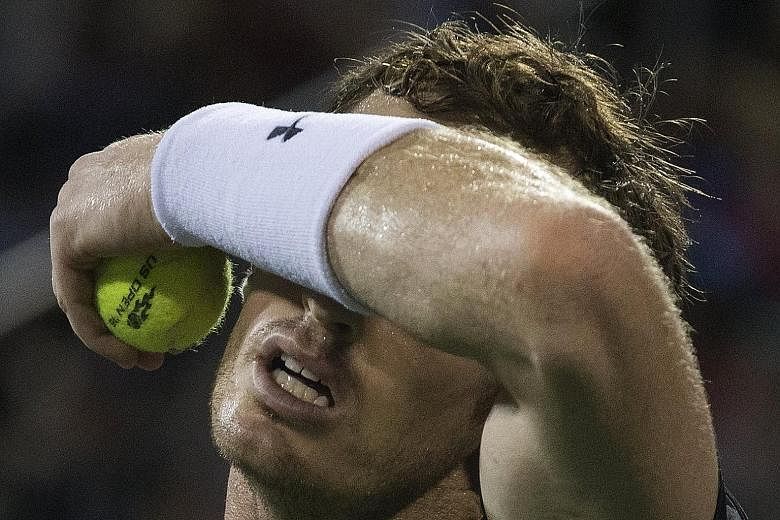 Andy Murray is disappointed after losing a point against Kevin Anderson on Monday.