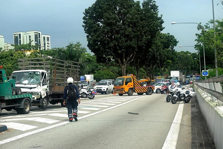 A lorry driven by Ng Leng Seng (above) crashed into a van, which then hit two men and a car on the Bukit Timah Expressway (left).
