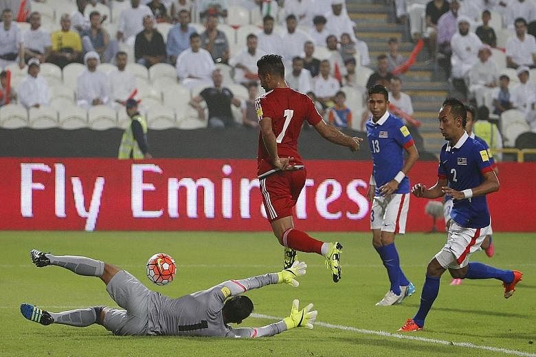 Malaysia (in blue) found themselves outclassed 0-10 by the United Arab Emirates in a World Cup qualifier in Abu Dhabi last week. The record loss has triggered demands for a major revamp.