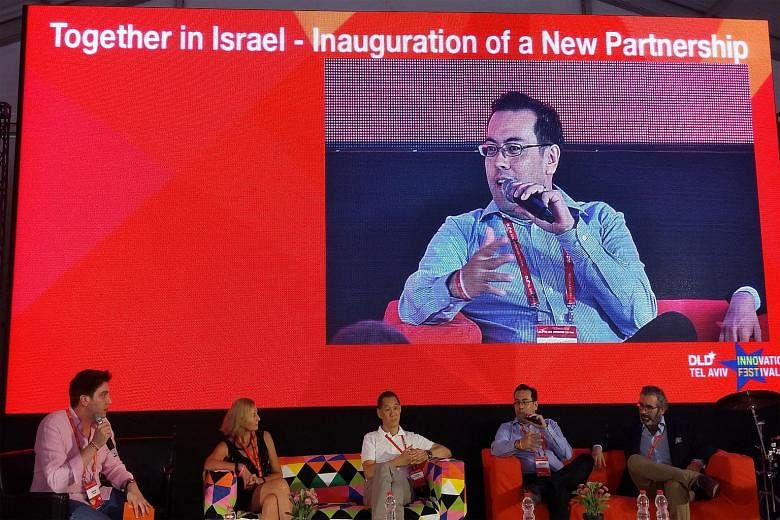 Singtel Innov8 CEO Edgar Hardless speaking at the launch of the partnership at the DLD Conference in Tel Aviv, with representatives from Orange, Deutsche Telekom and Telefonica.