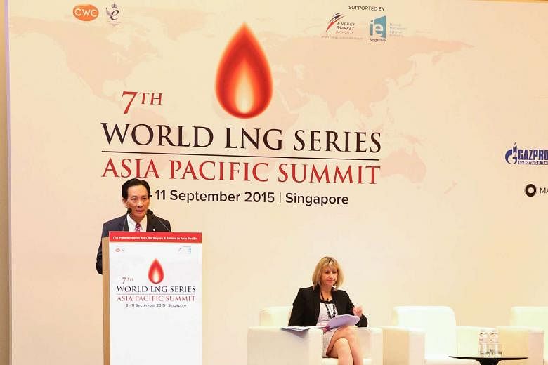 Mr Seah Moon Ming, group chief executive of Pavilion Energy, giving the keynote speech at the 7th LNG Asia-Pacific Summit yesterday. With him is Ms Pat Roberts, associate director of gas at CWC Group.
