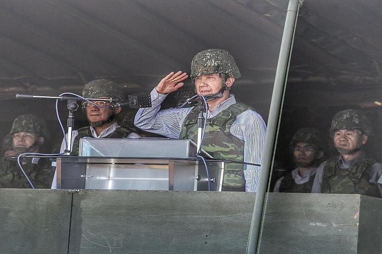 Taiwan President Ma Ying-jeou saluting during the Han Kuang 31 live fire drill in Hsinchu, northern Taiwan, yesterday.