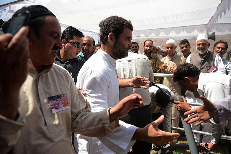 Mr Rahul Gandhi (centre) meeting saffron farmers last month while on a three-day visit to Jammu and Kashmir. The Congress party vice-president has spoken up for the rights of the common folk, from farmers and fishermen to home buyers and students.