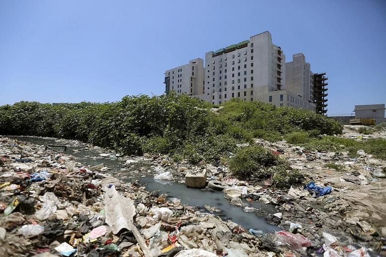 Trash piling up around Gleneagles Khubchandani Hospital in Mumbai. Parkway Pantai, a subsidiary of IHH Healthcare, has been forced to delay its opening, originally planned for 2012, while awaiting the necessary permits.