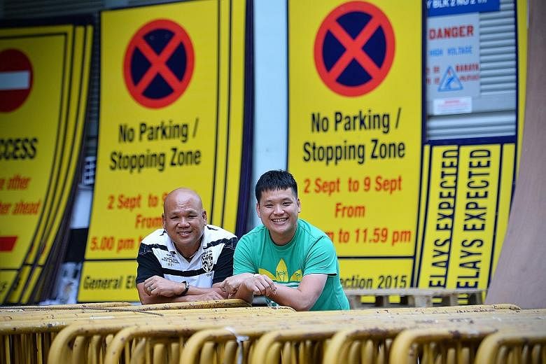 S-Lite Event Support founder Thomas Ang (left) and his son Vernon. Sporting events account for more than 70 per cent of its business, with the rest being community and cultural showpieces.