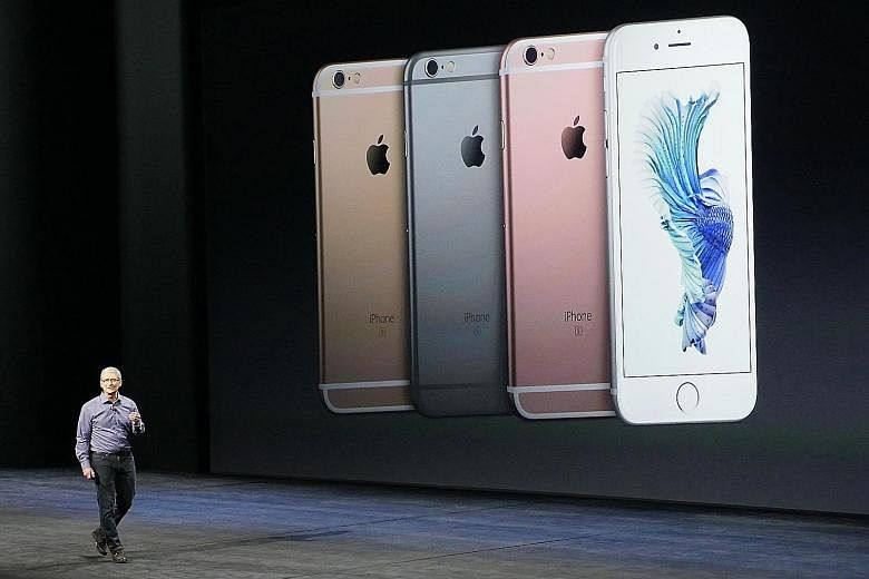 Apple chief executive Tim Cook launched the new iPhones at the Bill Graham Civic Auditorium in San Francisco on Wednesday.