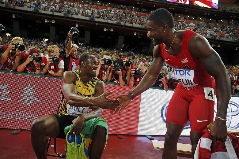 Usain Bolt (far left) shakes hands with Justin Gatlin after winning the 200m final at the World Championships in Beijing. The Jamaican once again proved that he can be counted on to deliver on big occasions.