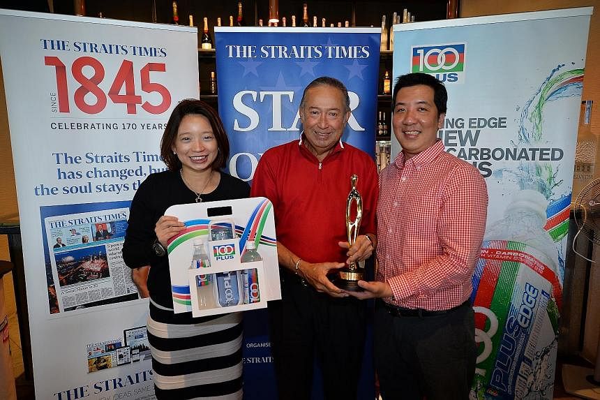 Far left: Colin Schooling (centre), father of Singapore swimmer Joseph, receiving the ST Athlete of the Month trophy from Straits Times sports editor Marc Lim. With them is Celine Tan, marketing manager of F&N.