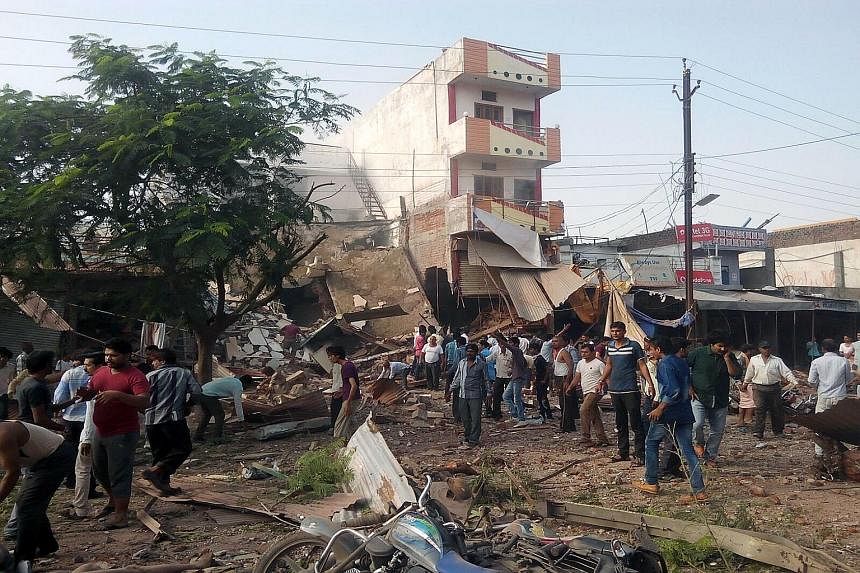 Volunteers and rescue workers using their bare hands to move the rubble in search of survivors. The gas cylinder exploded as workers and school children were gathering for breakfast at the restaurant, in the town of Petlawad in the state of Madhya Pr