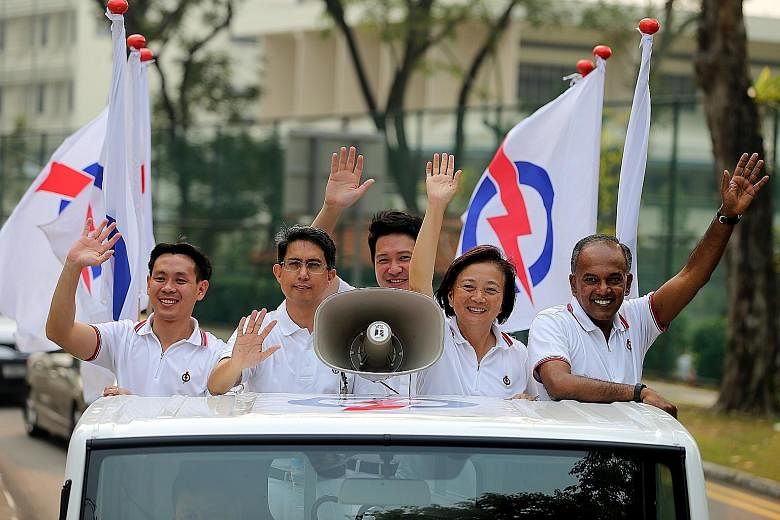 Nee Soon GRC's (from left) Louis Ng, Muhammad Faishal lbrahim, Henry Kwek, Lee Bee Wah and K.Shanmugam, thank voters.