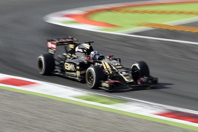 Romain Grosjean finished third at the Belgian Grand Prix but the team's cars were impounded. Lotus say the dispute, part of a legal action brought by former reserve driver Charles Pic, has been resolved.