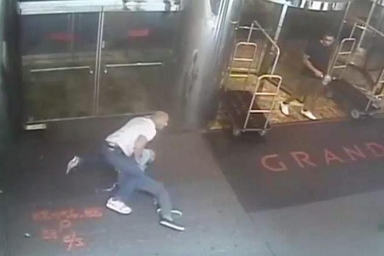 Retired professional tennis player James Blake (above) was mistaken for a suspect in a fraud case. In the video (left), officer James Frascatore (in white shirt) is seen wrapping an arm around Mr Blake's neck and throwing him onto the sidewalk.