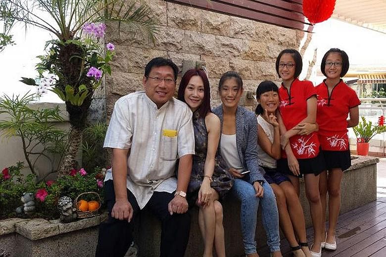 (From left) Mr Liew Eng Leng, 50, his wife Hazel Ng, 49, and their daughters Nobelle, 21, Novia, 19, Norine, 14, and Nolene, 14. Mr Liew is interested in football and has written on the subject.