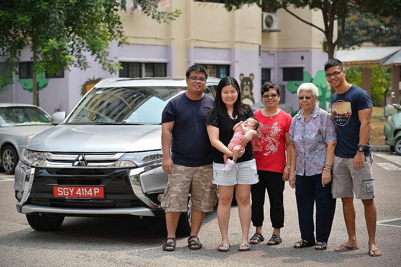 Off-peak car owner Jeosiah Wee (far left) with his family. Mr Wee uses his car on weekends and for taking his family out.