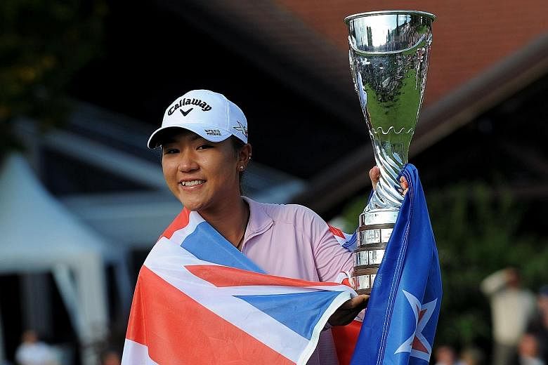 Lydia Ko with her trophy after winning the year's final Major, the Evian Championship, yesterday. The 18-year-old is 171 days younger than Morgan Pressel was when she won the 2007 Kraft Nabisco Championship.