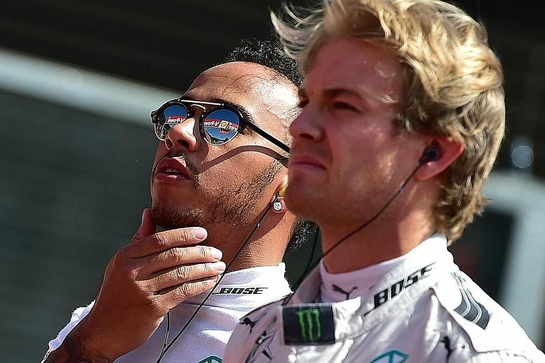 Mercedes team-mates and title rivals Lewis Hamilton (left) and Nico Rosberg. Hamilton leads the world championship by 53 points, but a defiant Rosberg said: "I won't be giving up the fight - no way. Singapore is one of my favourite races, so that's a